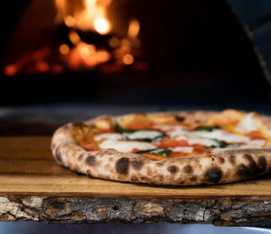 pizza on brown wooden table